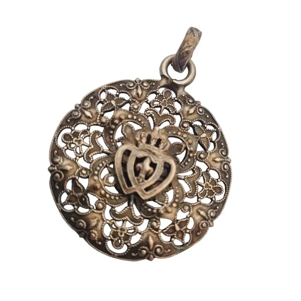 Antique silver Coeur Vendéen rosette, fleur-de-lis and intertwined hearts.