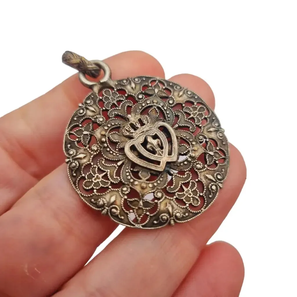 Antique silver Coeur Vendéen rosette, fleur-de-lis and intertwined hearts.