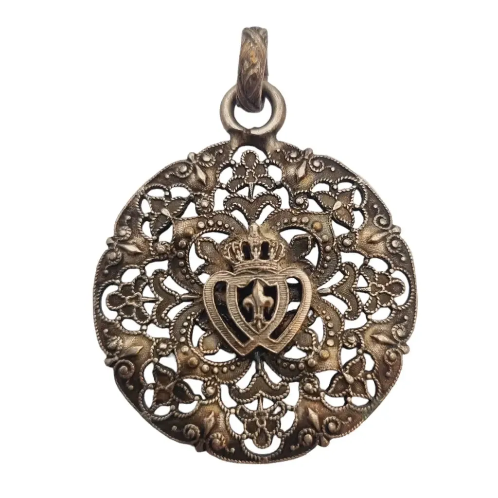 Antique silver Coeur Vendéen rosette, fleur-de-lis and intertwined hearts.